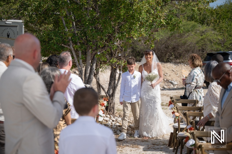 Wedding ceremony at Playa Hunku in Curacao with guests and family present