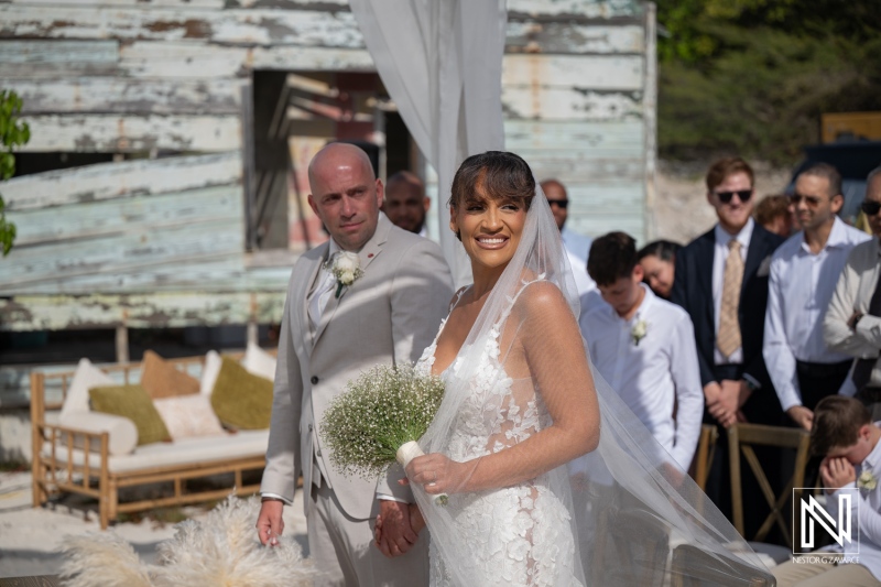 Wedding ceremony at Playa Hunku in Curacao with couple and guests