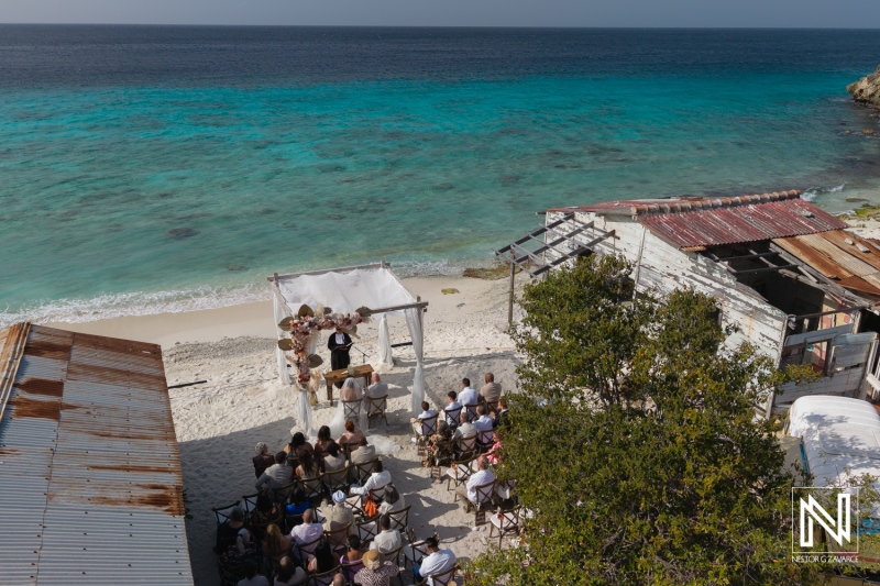 Wedding ceremony at Playa Hunku in Curacao by the beach with guests gathered