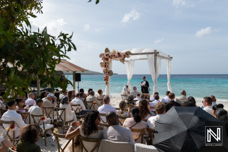 Wedding celebration at Playa Hunku in Curacao with guests gathered on the beach