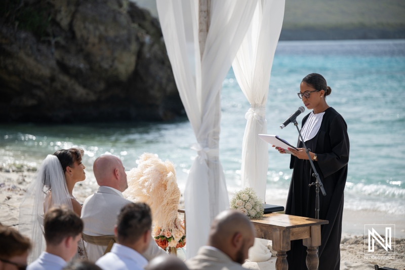 Wedding ceremony at Playa Hunku in Curacao with guests and officiant