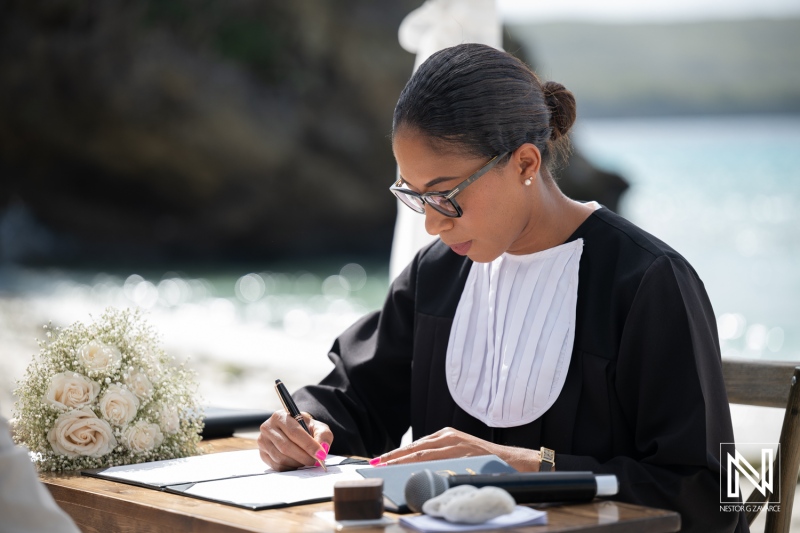 Ceremony at Playa Hunku in Curacao where a person prepares for a wedding event