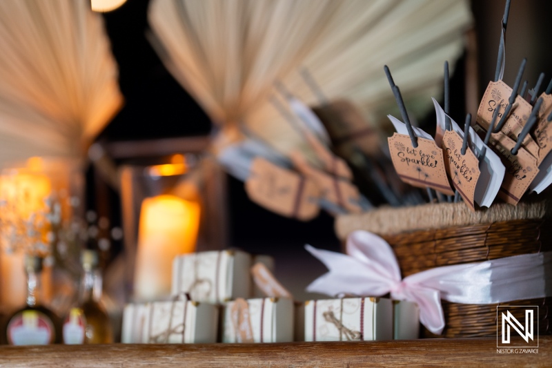 Wedding decorations at Playa Hunku in Curacao feature gifts and sparkler tags for guests