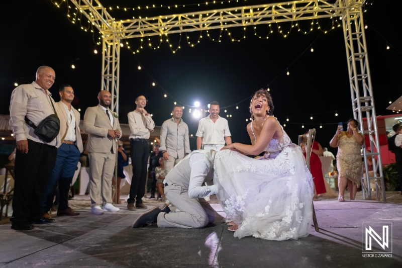 Wedding celebration at Playa Hunku in Curacao with guest interactions and joyful moments