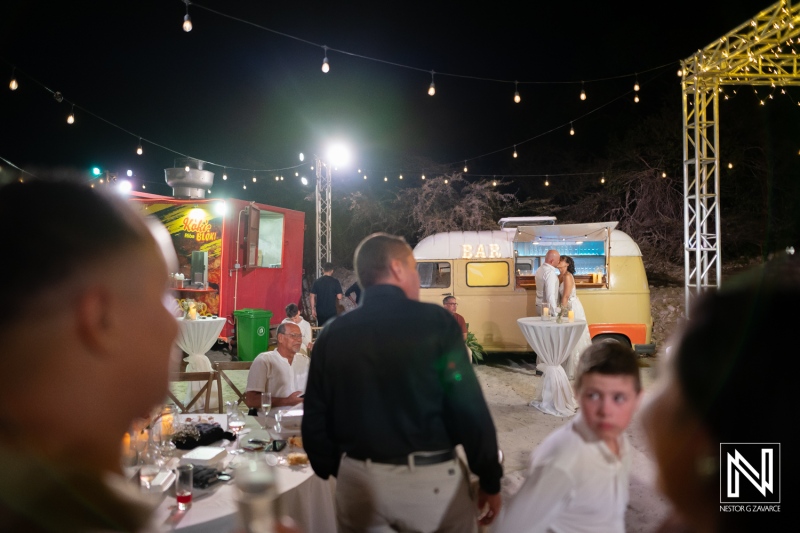 Wedding celebration at Playa Hunku in Curacao during the evening with guests and decorations