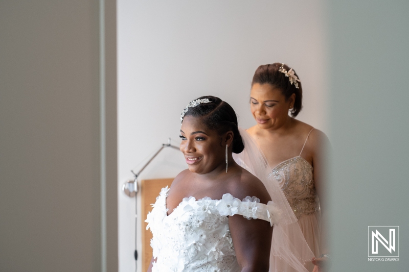 Maid of honor helping the bride to get ready
