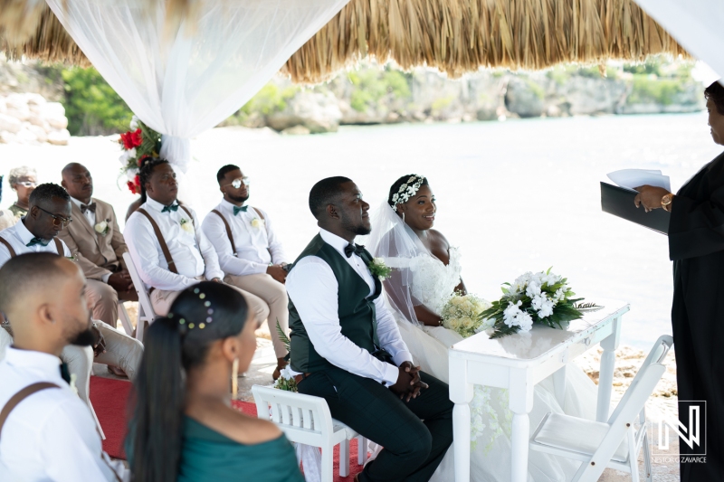 Bride and groom atteding in the civil ceremony at the beach