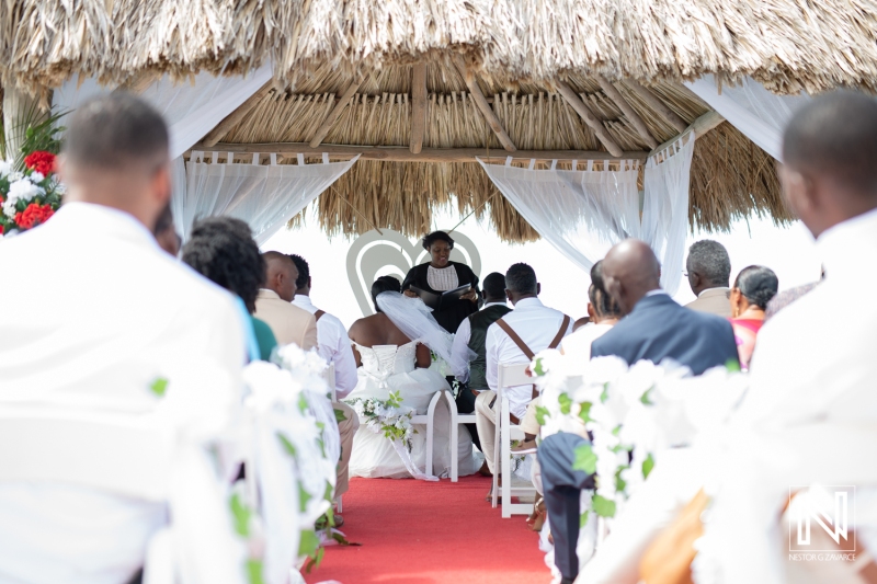 Bride and groom atteding in the civil ceremony at the beach