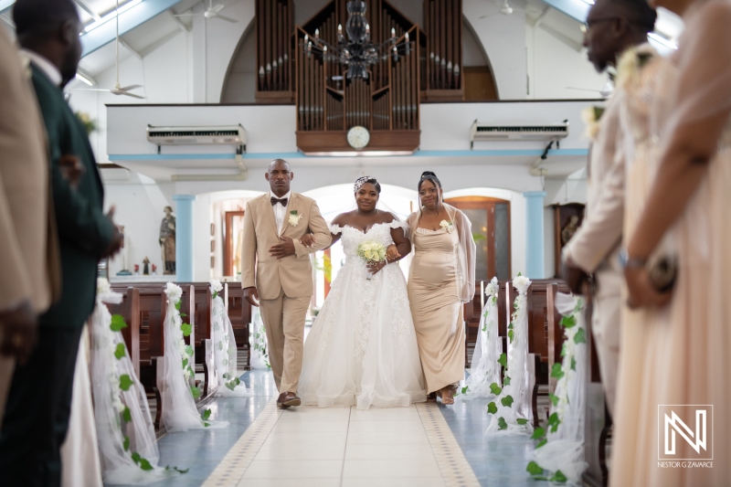 Bride walking the aisle with her parents