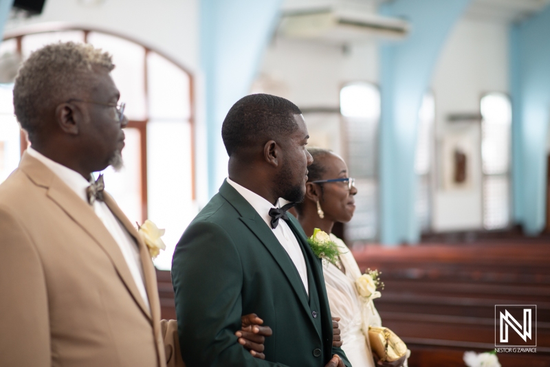 Groom waiting for the bride at the aisle