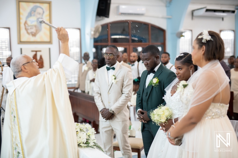 Priest giving his blessing to the couple in the church