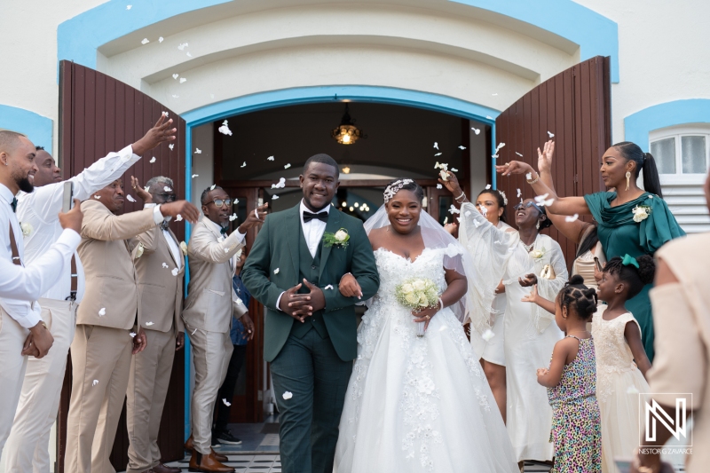 departure of the bride and groom at the church with flower petals