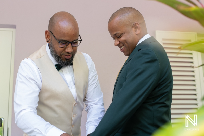 Groom getting into attire