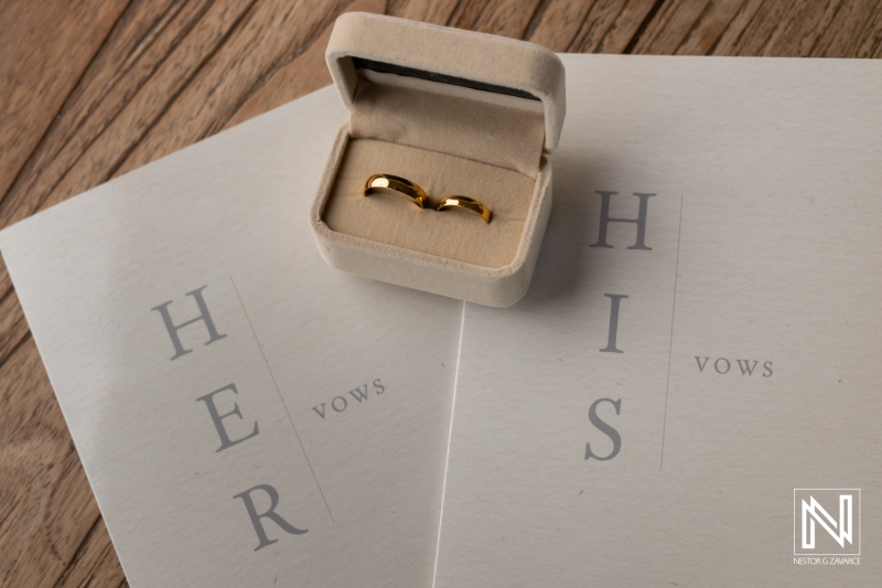 Wedding rings and vow cards displayed at Landhuis Klein Santa Martha in Curacao during a celebration of love and commitment