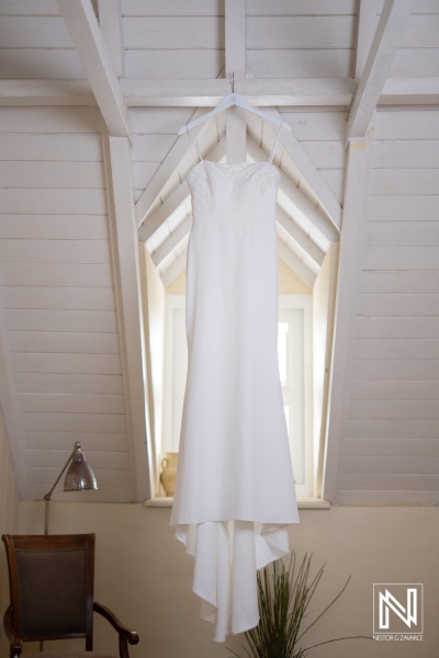 Wedding dress hanging in charming Landhuis Klein Santa Martha in Curacao, preparing for a beautiful wedding ceremony