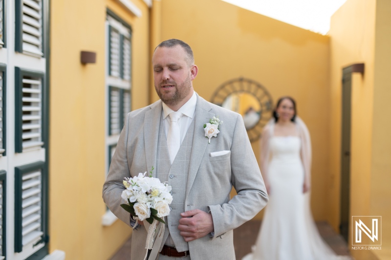 Romantic wedding ceremony at Landhuis Klein Santa Martha in Curacao with groom and bride in picturesque setting