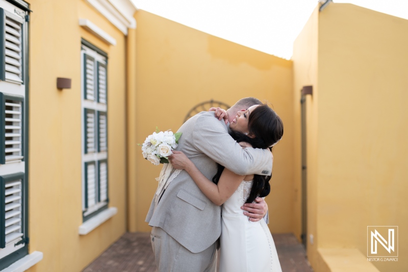 Couple celebrates their love with an emotional embrace at Landhuis Klein Santa Martha in Curacao during a beautiful wedding ceremony