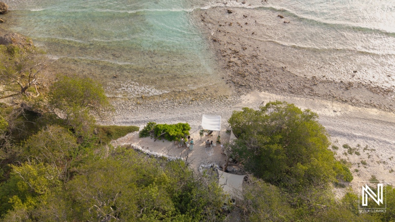 Wedding celebration at Landhuis San Nicolas in Curacao overlooking the beautiful coastline and tranquil waters during sunset