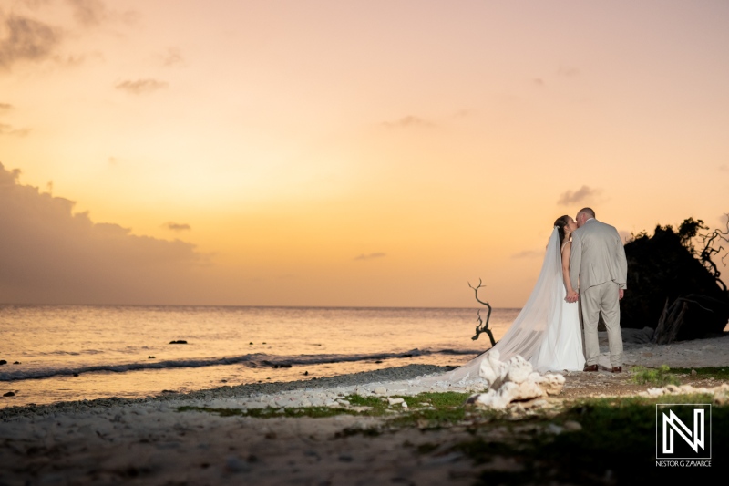 Captured moment of love and joy during a picturesque wedding at Landhuis San Nicolas in Curacao under a stunning sunset