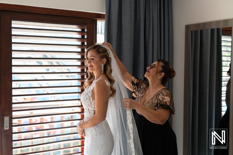 Bride getting into attire