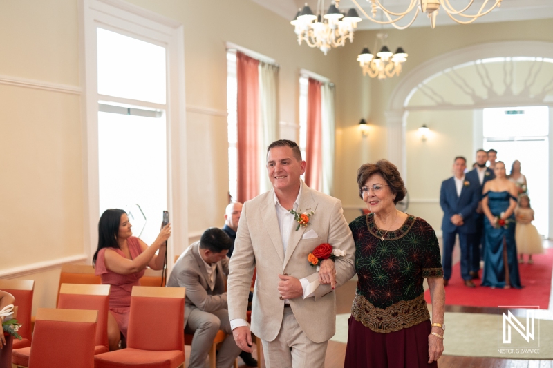 Groom walking down the aisle