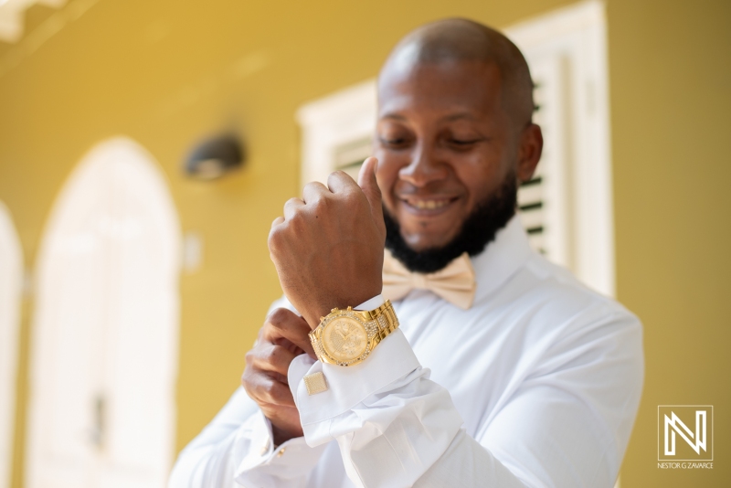Groom getting into attire
