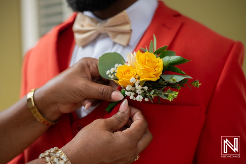 Groom getting into attire