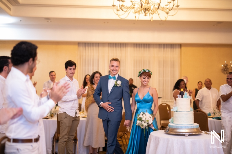 Bride and groom entering the reception