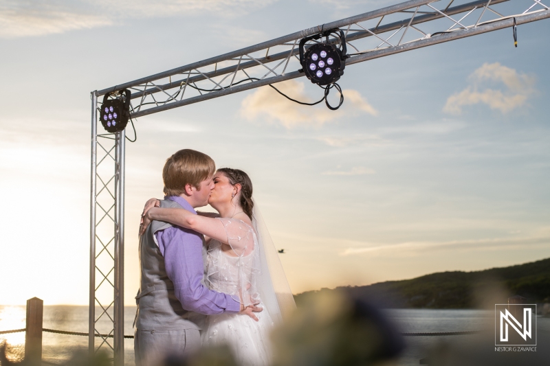 Bride and groom first dance in the sunset