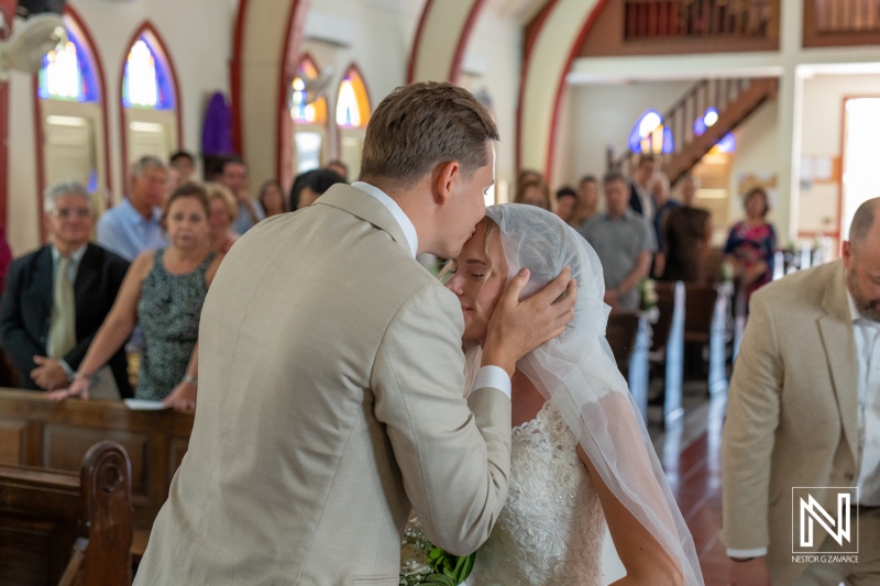 Couple shares an emotional moment during Misa Di Jandoret wedding ceremony in Curacao