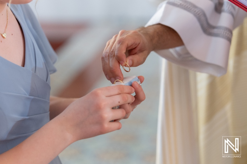 Ceremony in Curacao celebrating Misa Di Jandoret with wedding rings exchanged during a beautiful wedding moment