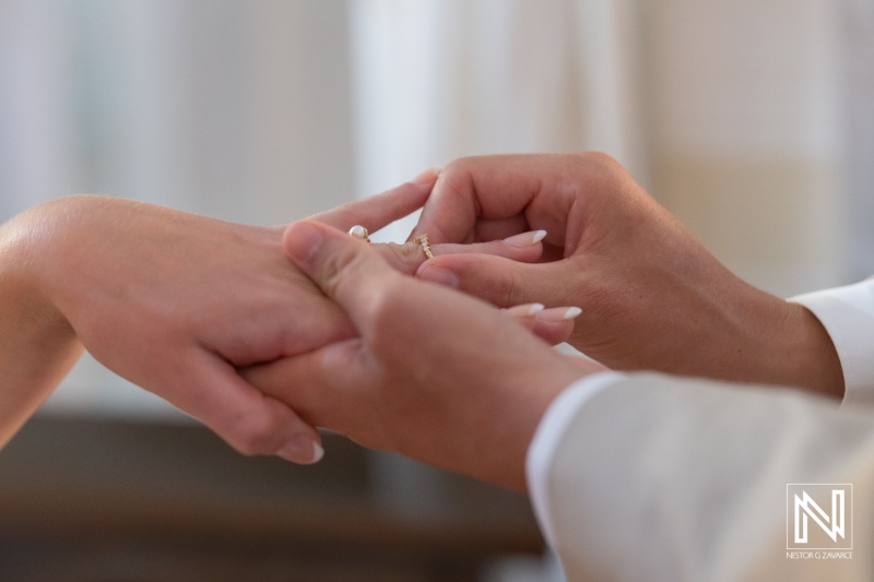 Celebration of love during a wedding ceremony in Curacao at Misa Di Jandoret featuring a ring exchange