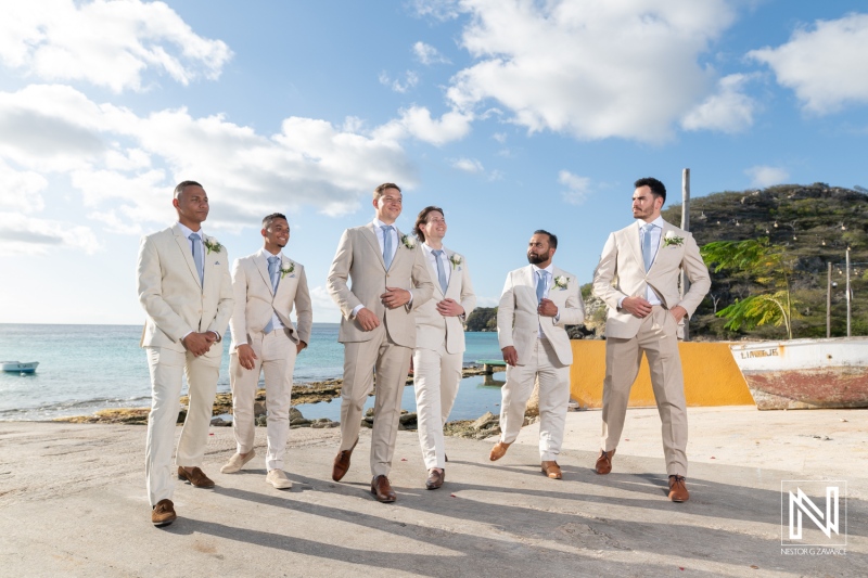 Wedding party enjoying the beautiful seaside atmosphere in Sint Michiel, Curacao, during a sunny day celebration