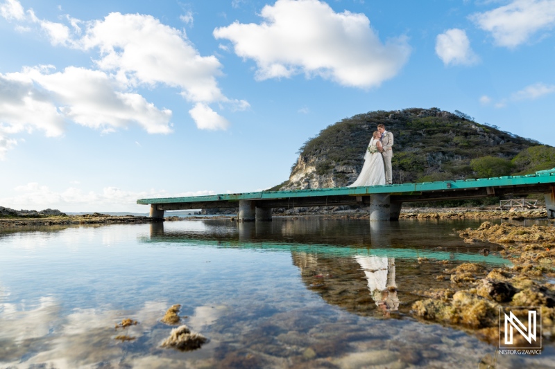 Couple celebrates their wedding on the serene shores of Sint Michiel in Curacao surrounded by natural beauty and a clear blue sky
