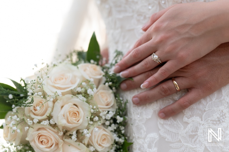 Romantic wedding ceremony in Curacao at Playa Porto Mari featuring vows and a beautiful bouquet