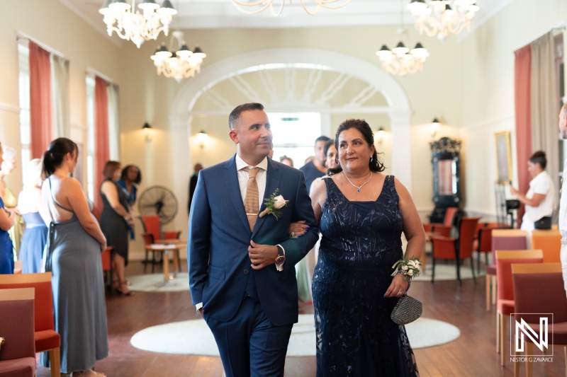 Groom walking down the aisle