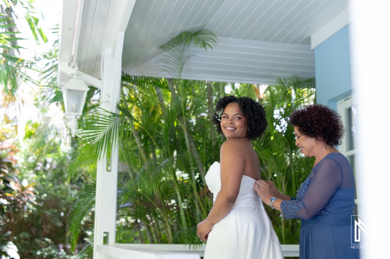 Bride getting into attire