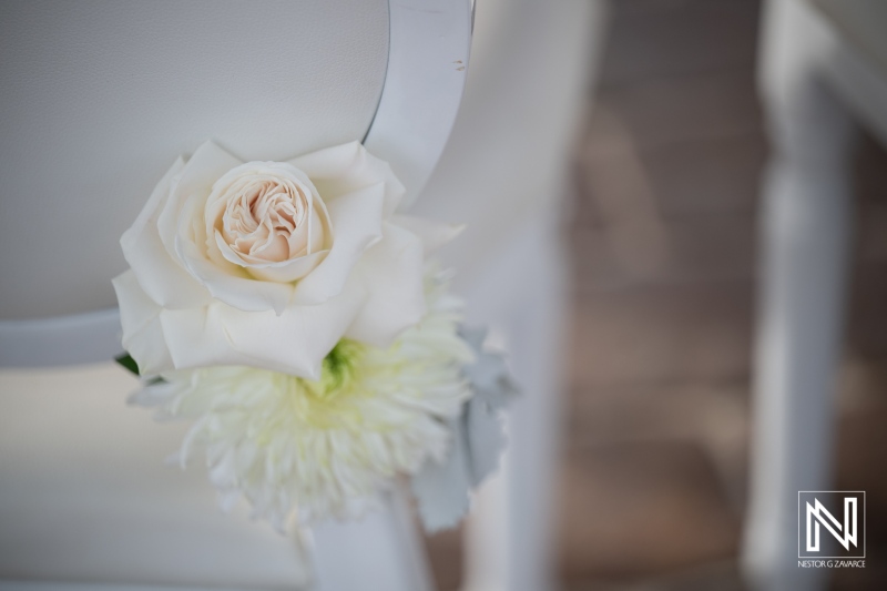 Wedding decoration with flowers at Dreams Curacao Resort during an outdoor ceremony