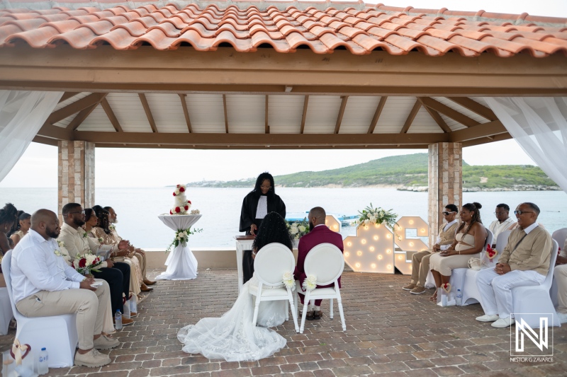 Wedding ceremony at Dreams Curacao Resort with officiant and guests present