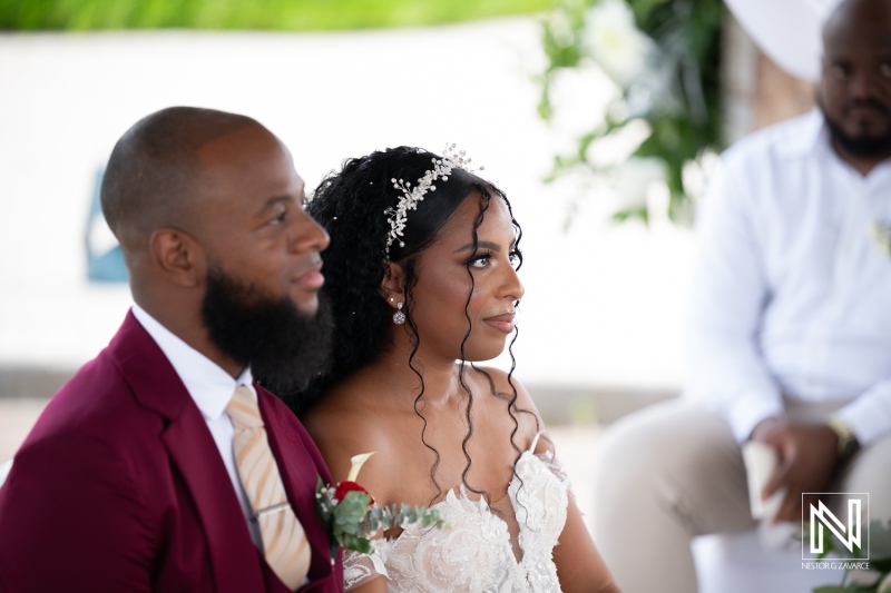 Couple exchanges vows at wedding ceremony in Dreams Curacao Resort on a sunny day