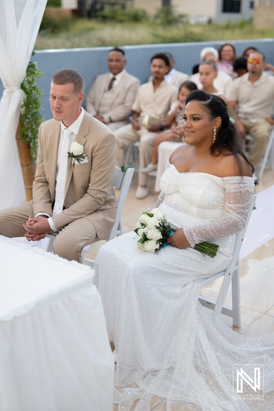 Beautiful wedding celebration in Curacao with couple surrounded by guests, showcasing love and joy in an outdoor setting
