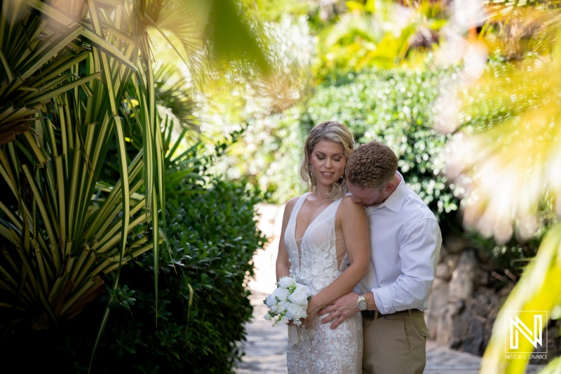 Wedding ceremony at Mood Beach in Curacao with couple surrounded by greenery