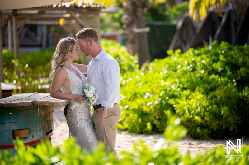 Couple exchanges vows on the beach at Mood Beach in Curacao during a sunny wedding ceremony
