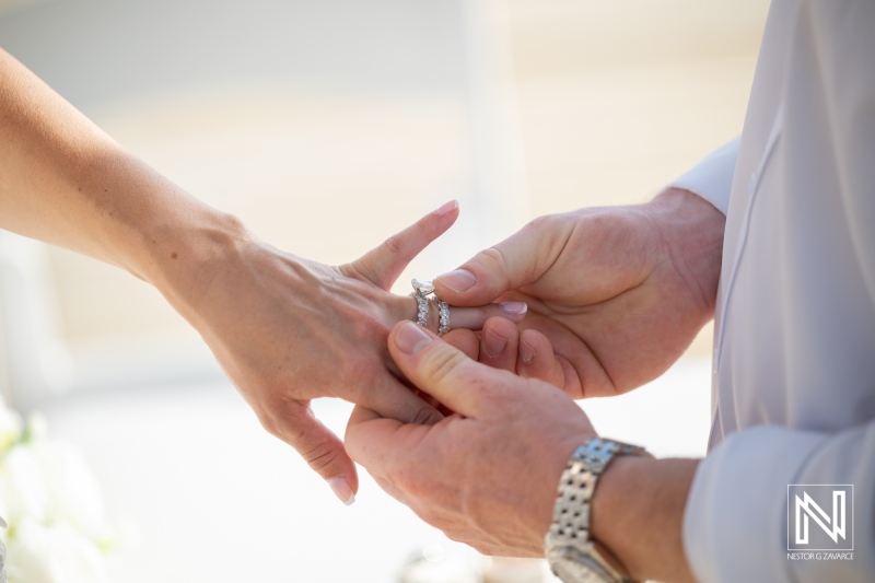 Wedding ceremony at Mood Beach in Curacao with ring exchange between couple during their special moment by the sea