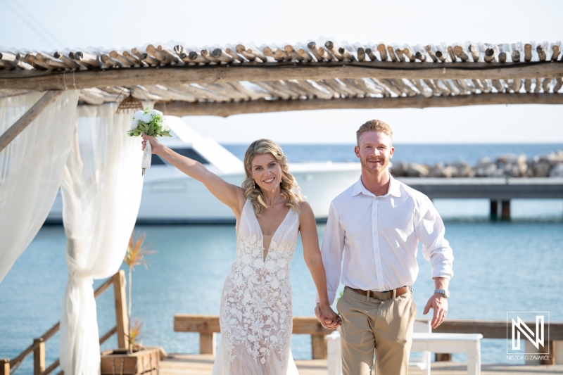Couple celebrates their wedding at Mood Beach in Curacao with joy and happiness