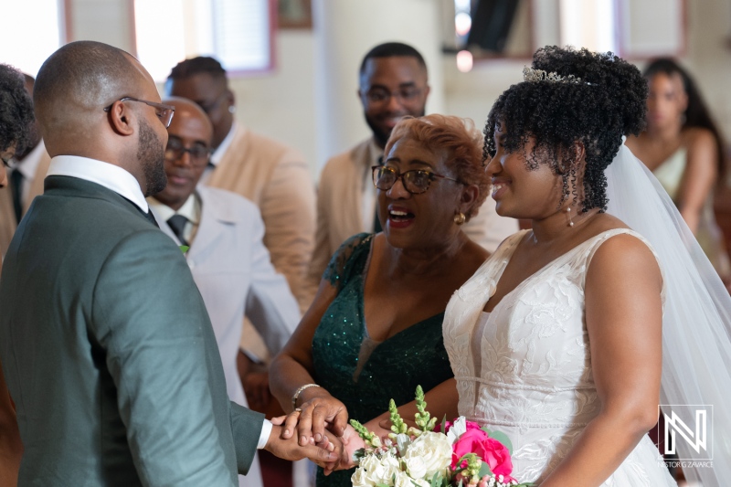 A Joyful Wedding Ceremony Takes Place in an Elegant Venue With Family and Friends Celebrating the Couple\'s Love During a Heartfelt Exchange of Vows