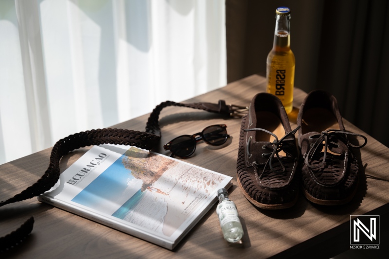 Couple prepares for wedding day at Avila Beach Hotel in Curacao with personal items on display