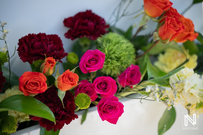 Flowers arranged for a wedding at Avila Beach Hotel in Curacao during the afternoon ceremony with colorful blooms and greenery