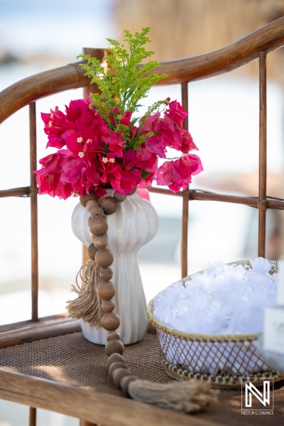 Bouquet and accessories at Avila Beach Hotel during a wedding ceremony in Curacao with bright flowers and decorative details