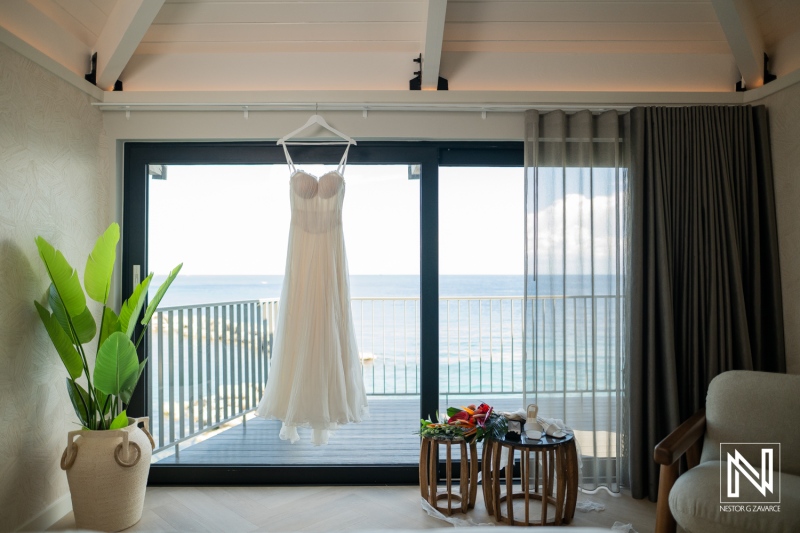 Wedding dress on display with ocean view at Avila Beach Hotel in Curacao during a wedding